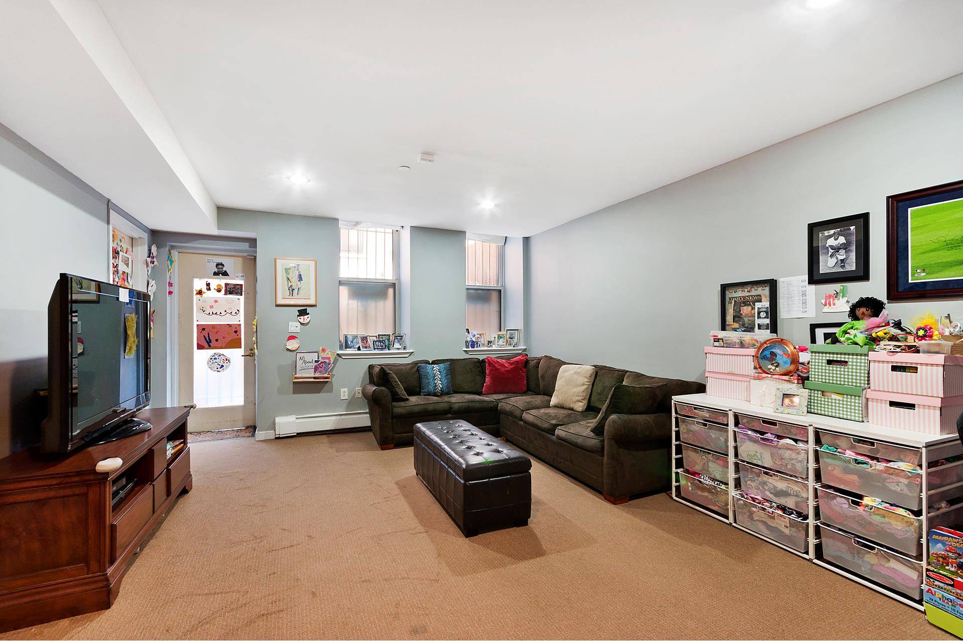 OPEN HOUSES ARE BY APPOINTMENT ONLY Offered is a generously sized 1, 512 square foot south facing duplex garden apartment that functions as a two bedroom home.