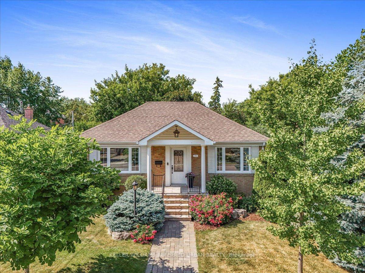 This Much loved sun filled brick bungalow is on a beautifully landscaped 44' lot where curb appeal and privacy go hand in hand !