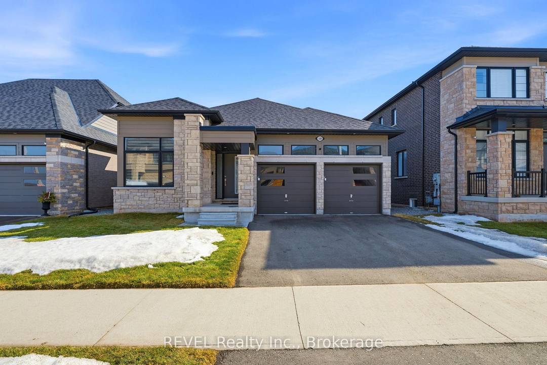 Year old, exceptional contemporary bungalow offering unobstructed, panoramic views of passing ships in the canal, situated in one of Welland's most prestigious neighbourhoods, Hunter's Pointe.