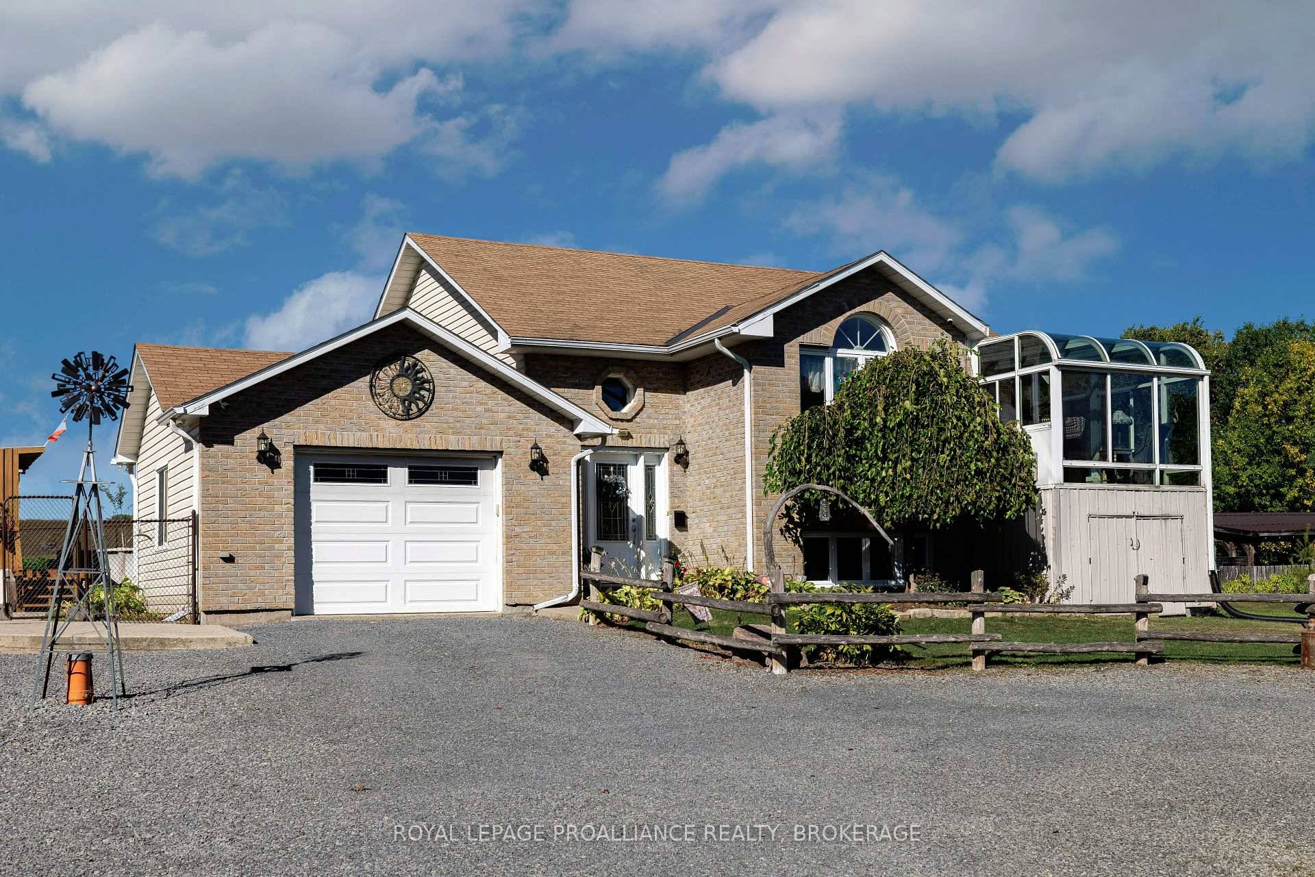 Beautifully updated and meticulously maintained raised bungalow, set on a private and manicured one acre lot just five minutes North of the 401.