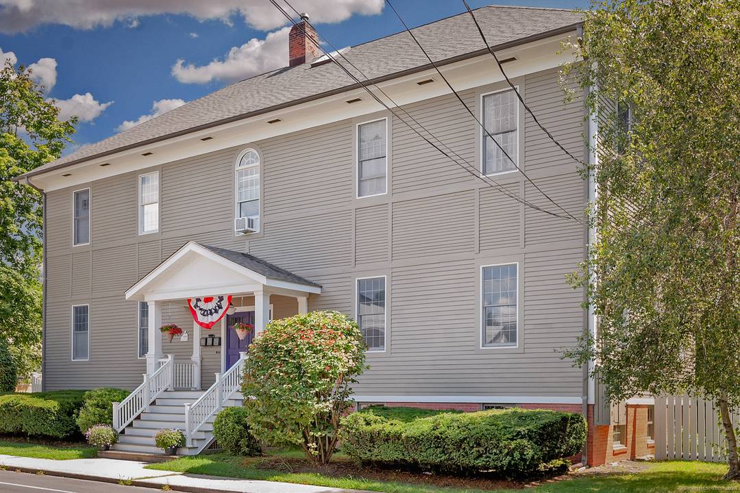 A FULLY FURNISHED, SHORT TERM RENTAL, 103C Boston Street is a FULLY FURNISHED light filled townhouse, in the historic Guilford Elementary School building, with large windows 12 ft ceilings.