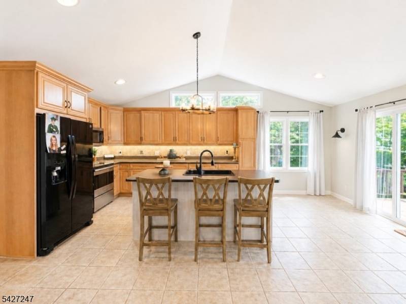 Welcome to this beautiful 3 bedroom, 2 full bath custom split level home situated on a quiet street and set on nearly one acre of level property.