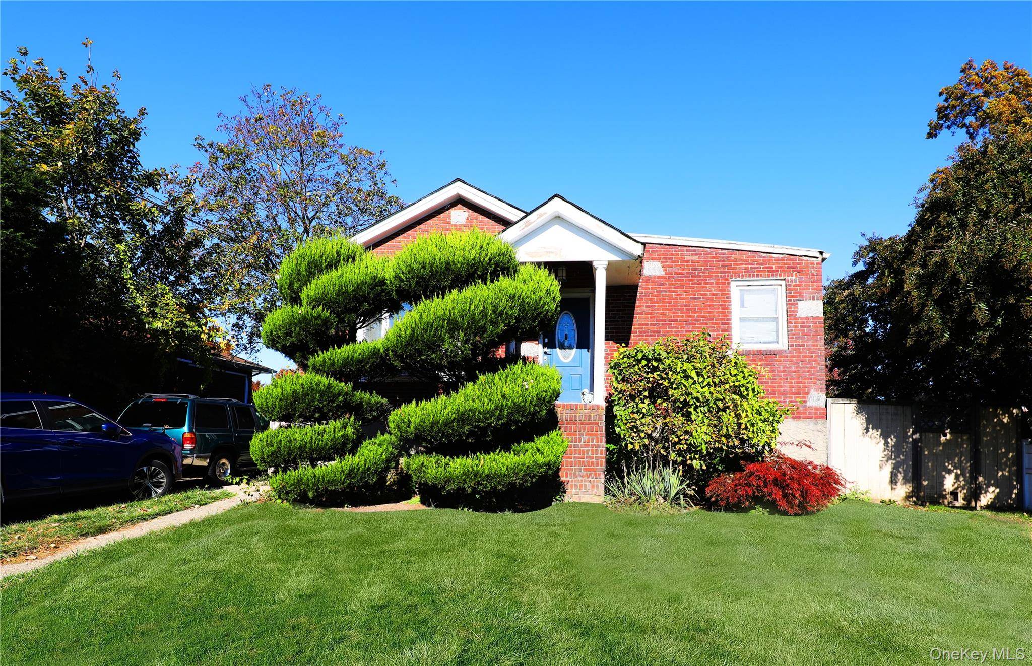 Welcome home to this spacious raised ranch perfectly situated in the heart of Merrick.