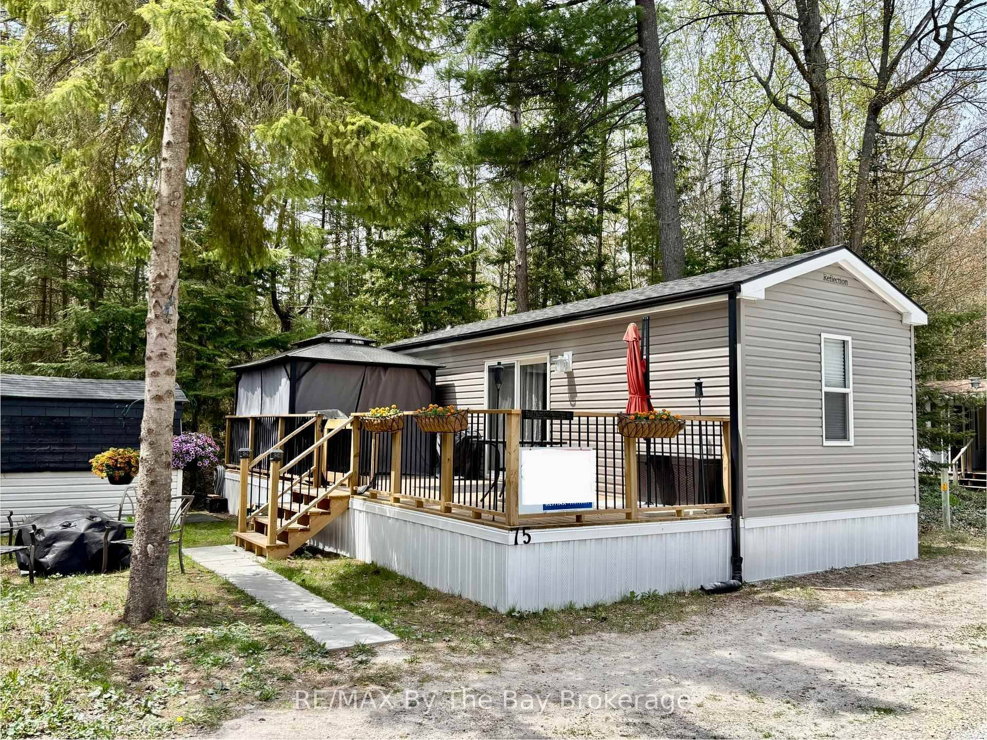 Enjoy breathtaking forest views and a short walk to the beach from this stunning seasonal retreat in the highly sought after Countrylife Resort !