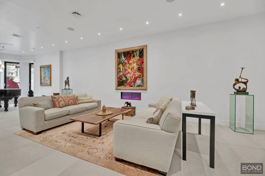 238 West 74th Street is an elegant Barrel Fronted Row House in the Neo Grec style with Romanesque influence, built in 1886 by William J Merrit.