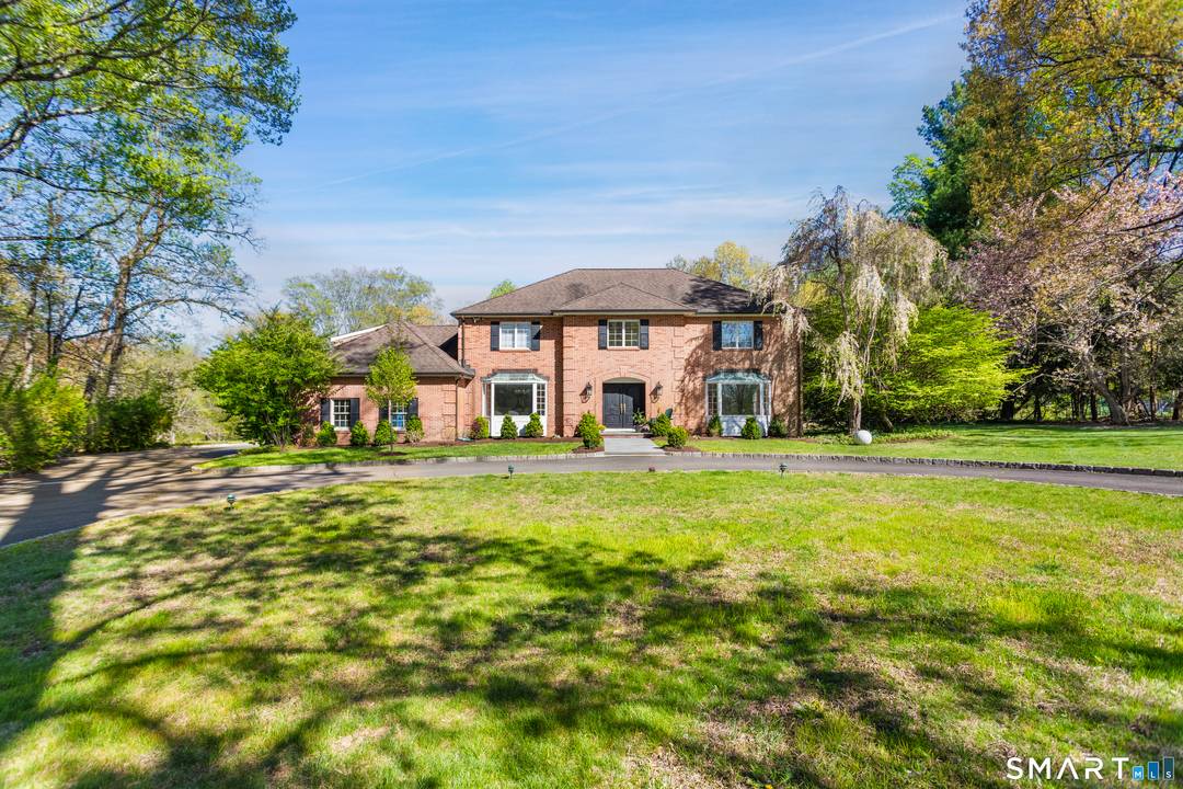 Set on 2. 77 manicured acres in North Stamford, 223 Jonathan Drive is a stately red brick colonial that seamlessly blends classic elegance with modern updates.