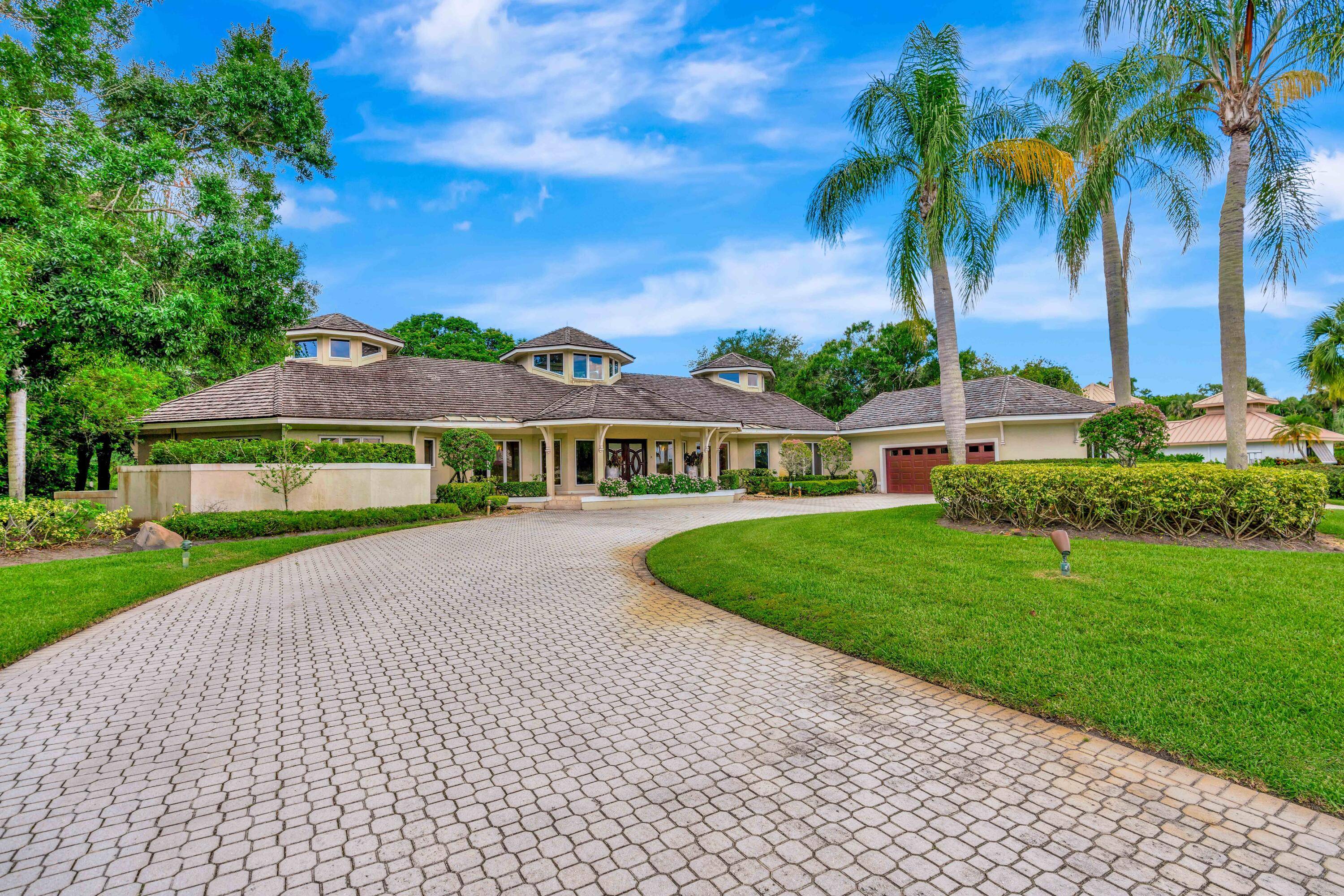 An absolutely unique custom estate, set on over a half acre of lush, manicured landscaping.