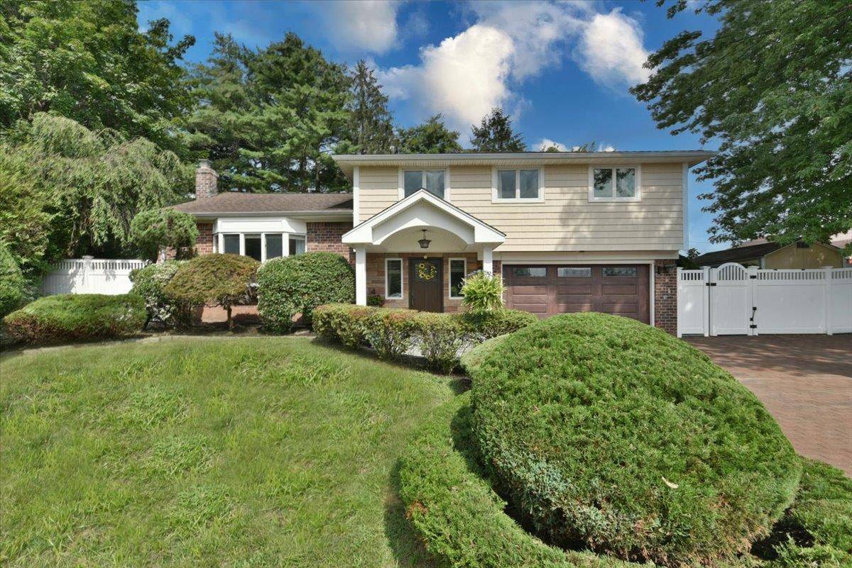 Tucked away on a private cul de sac corner lot, this meticulously maintained diamond split level home offers the perfect blend of classic comfort and modern updates.