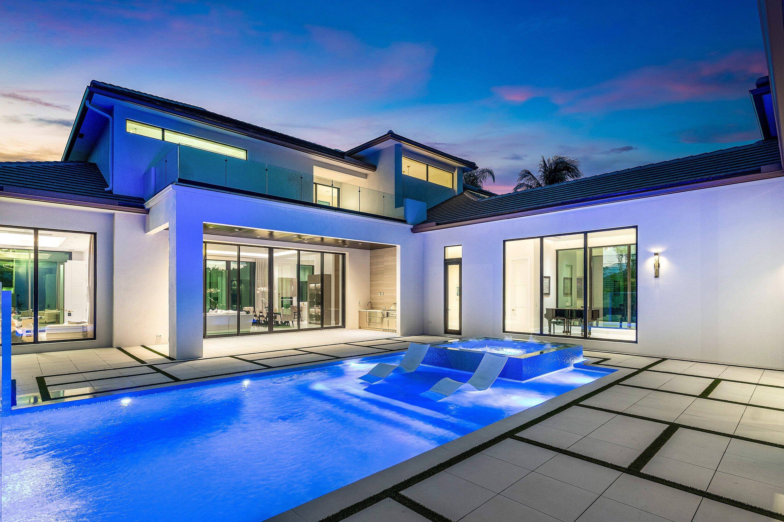 An architectural gem newly constructed in 2024, this custom built courtyard home showcases expanses of glass that seamlessly integrate the indoor and outdoor environments.