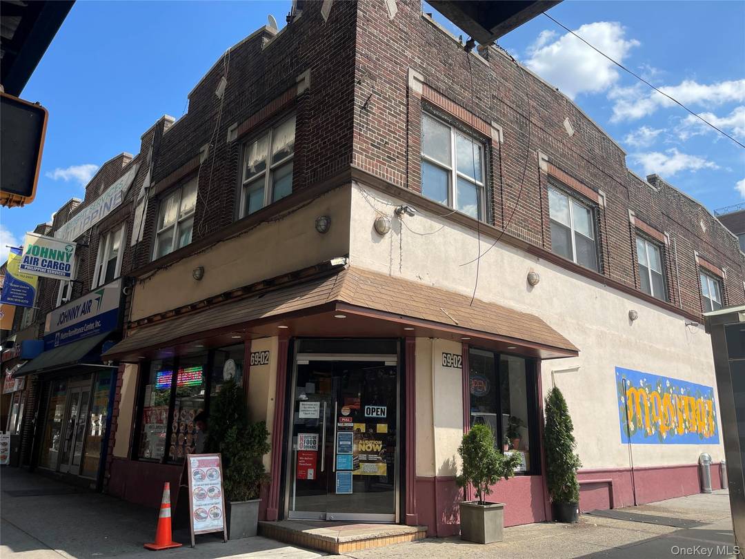 Exceptional corner commercial building on busy Roosevelt Avenue, offering unbeatable visibility and constant foot traffic.