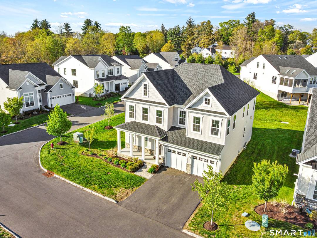 The ease of low maintenance living meets the space and comfort of a single family home in this stand alone home located in the desirable Enclave at Taunton Lake, a ...