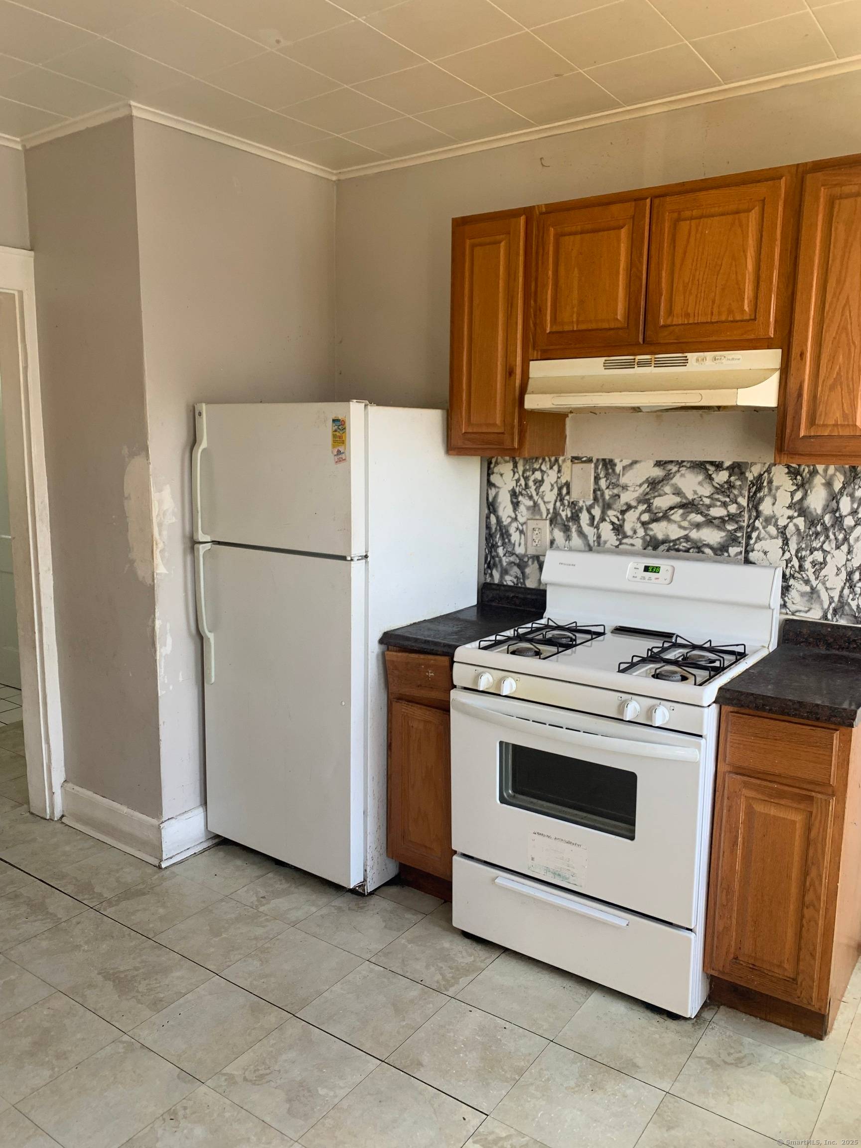 LARGE NORTH END 3 FAMILY INCLUDES 3 BEDROOM UNITS ON 1ST AND 2ND FLOOR PLUS 2 BEDROOM UNIT FOR THE 3RD FLOOR.
