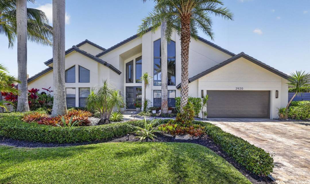 Exclusive Deep Water Elegance in prestigious Lighthouse Point on a highly desirable island street.