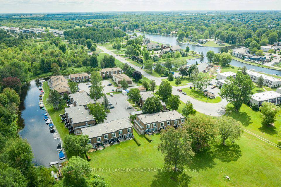 Immerse Yourself in Paradise with this Beach, Waterfront Condominium, Featuring a Boat Slip for Easy Access to Lake Simcoe and Beyond.