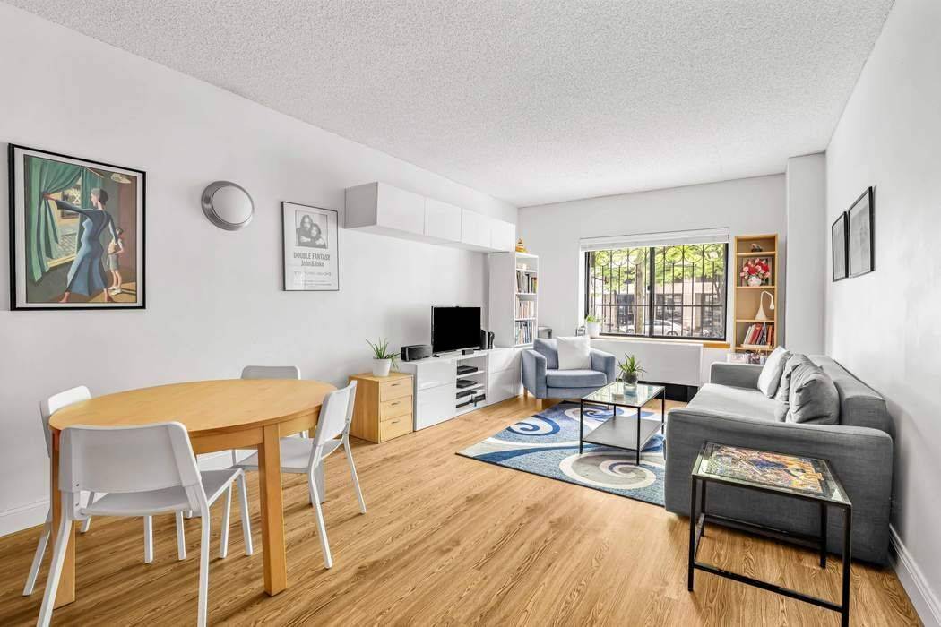 Step into this beautifully renovated one bedroom condo, perched on a raised first floor.