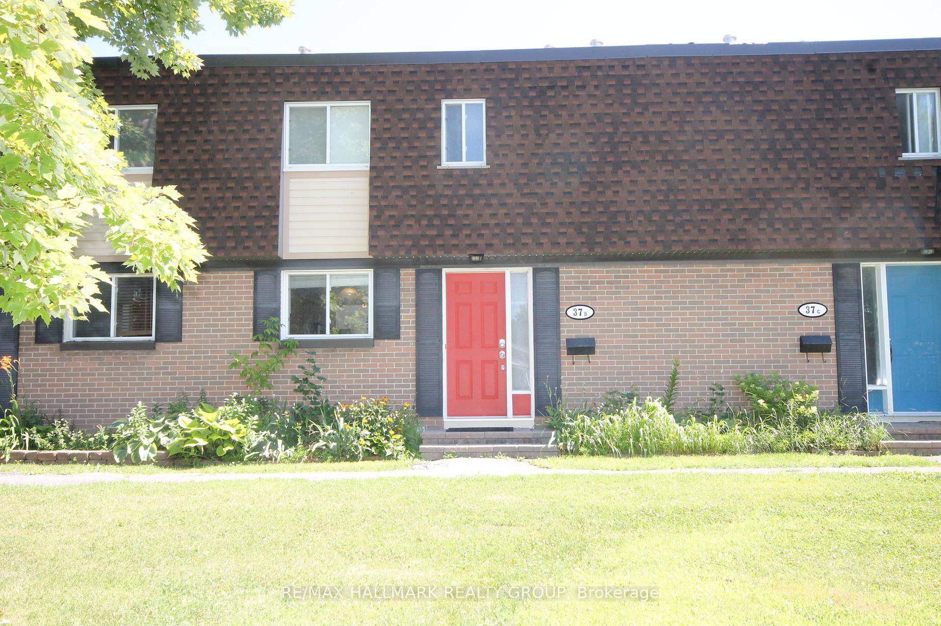 Spacious 3 bedroom 2 bath row unit with dark stained parquet hardwood throughout main and second level.