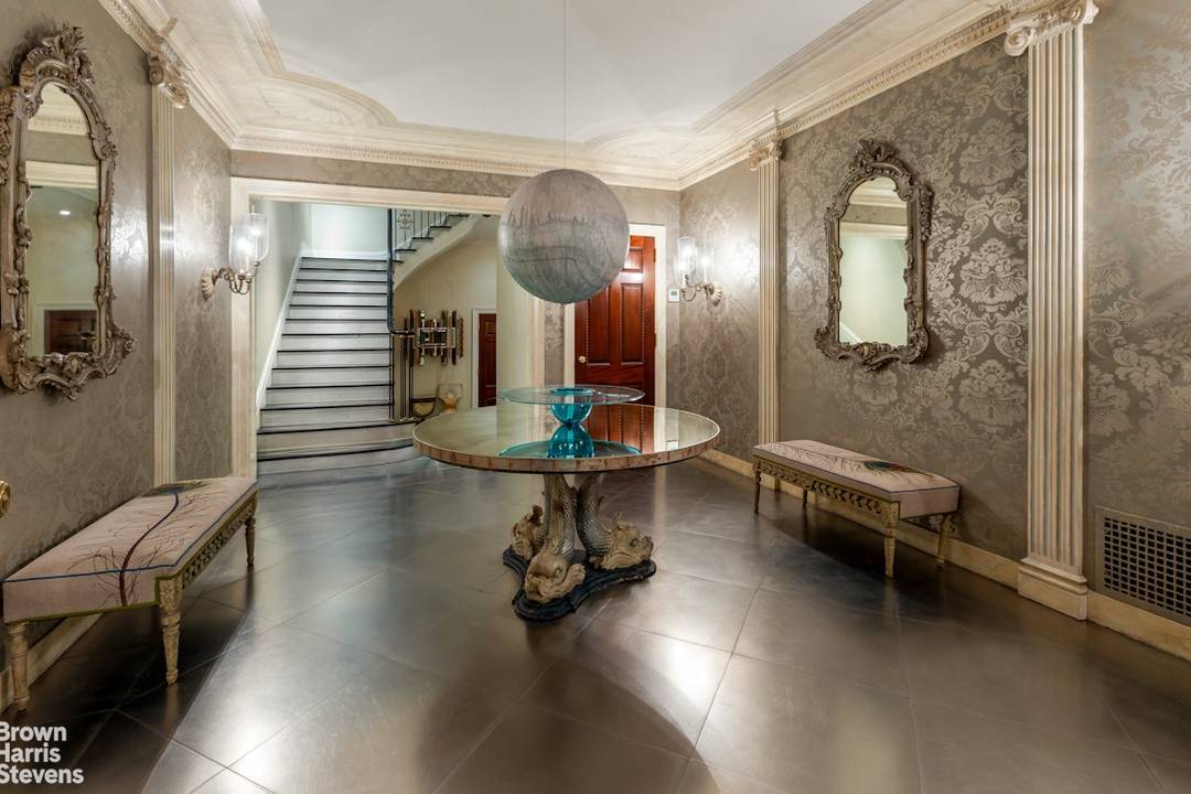 A Magnificent Townhouse of Timeless Elegance Both grand in scale and warmly inviting, this exceptional home just off Park Avenue offers over 8, 100 interior square feet of refined living.