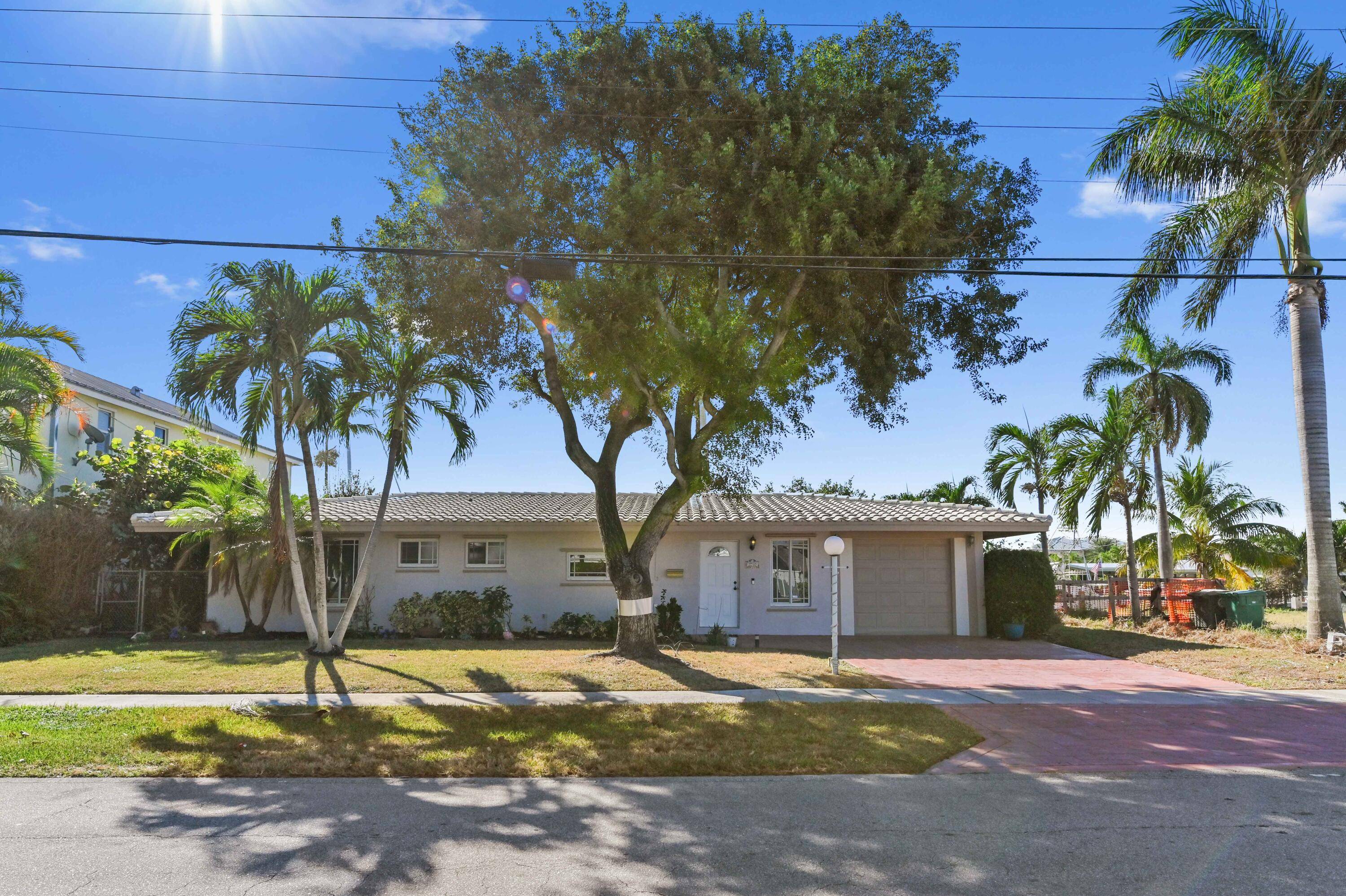 Immerse yourself in the tranquility and serenity of waterfront living at its finest, located at 2710 Northeast 48th Court in the peacefully picturesque Lighthouse Point, Florida.