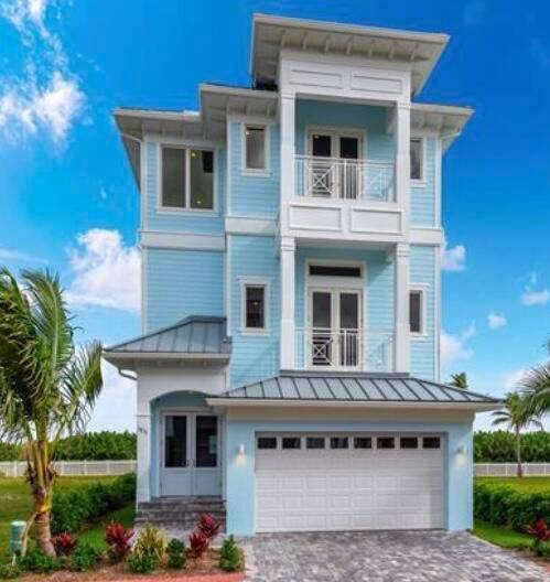 WELCOME TO PARADISE This Extraordinary Key West Style Oceanfront Home is located in a gated community in S.
