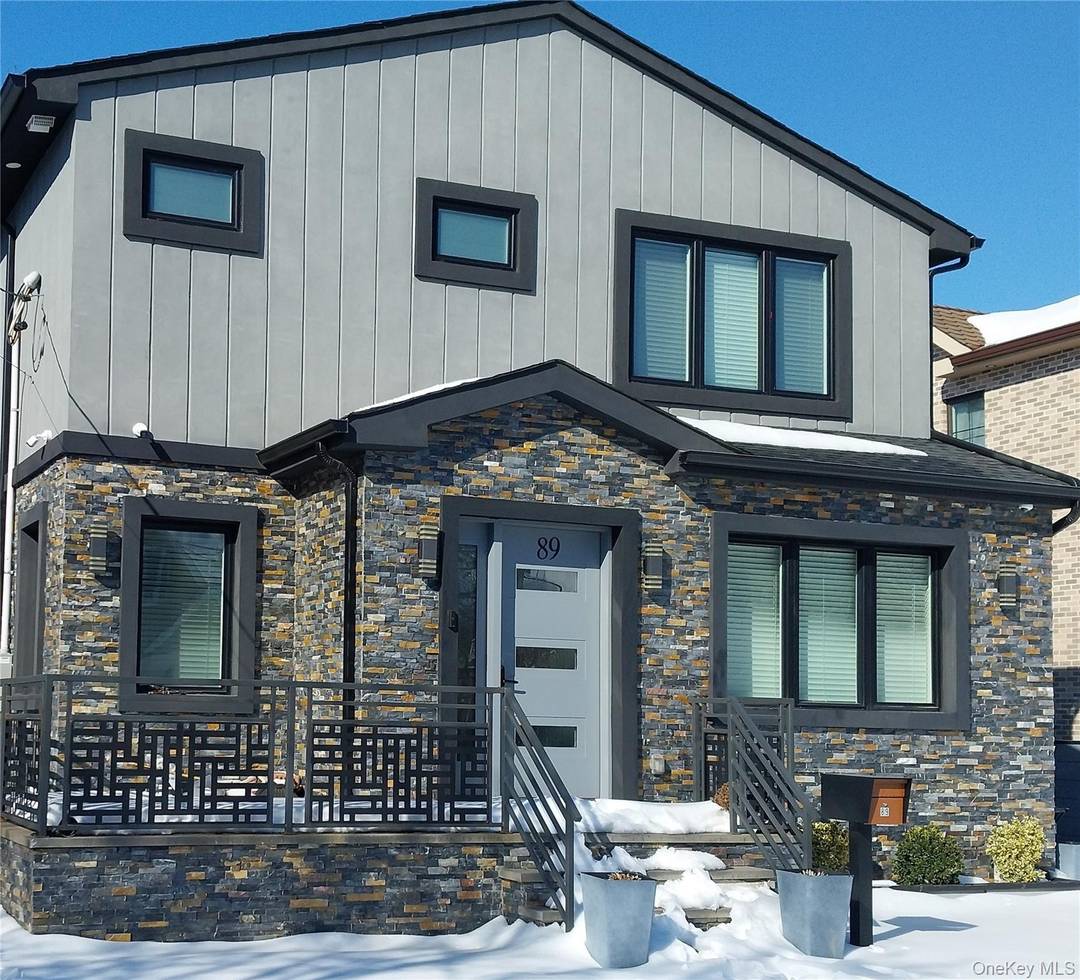 Extraordinarily beautiful, spacious refurbished house has a long driveway leading to a 1 car garage.