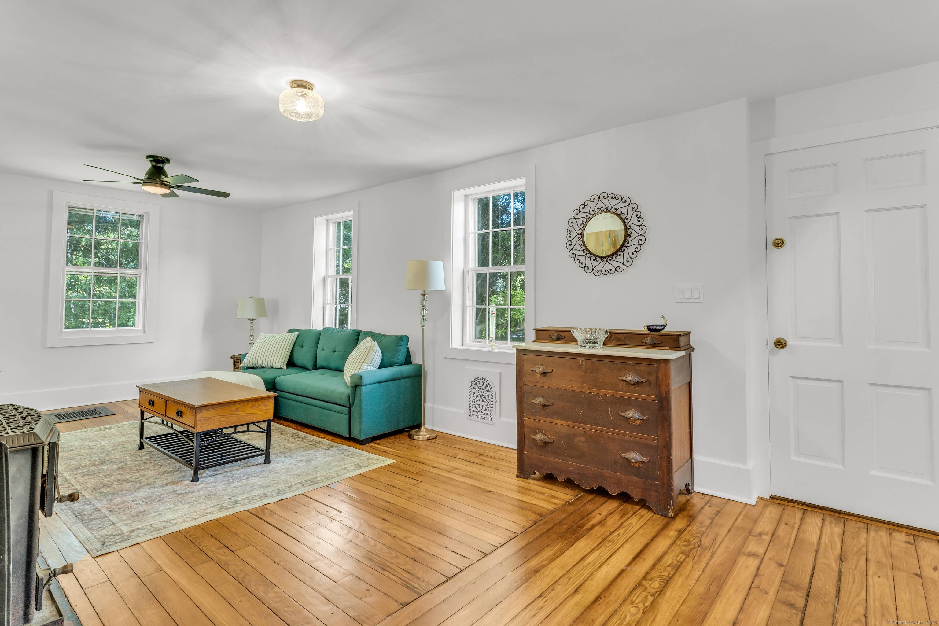 Welcome to this beautifully preserved and tastefully updated antique home, ideally situated on a generous 0.
