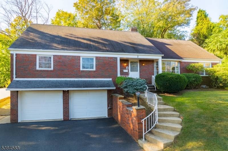 This magnificent custom expanded ranch with fenced in yard sits on a quiet cul de sac in a premier Springfield location, across from Baltusrol Golf Course.