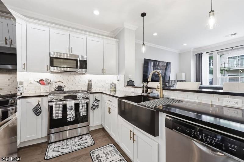 Welcome to 915 Redspire Drive, a beautifully upgraded residence in the sought after Hickory Manor community.