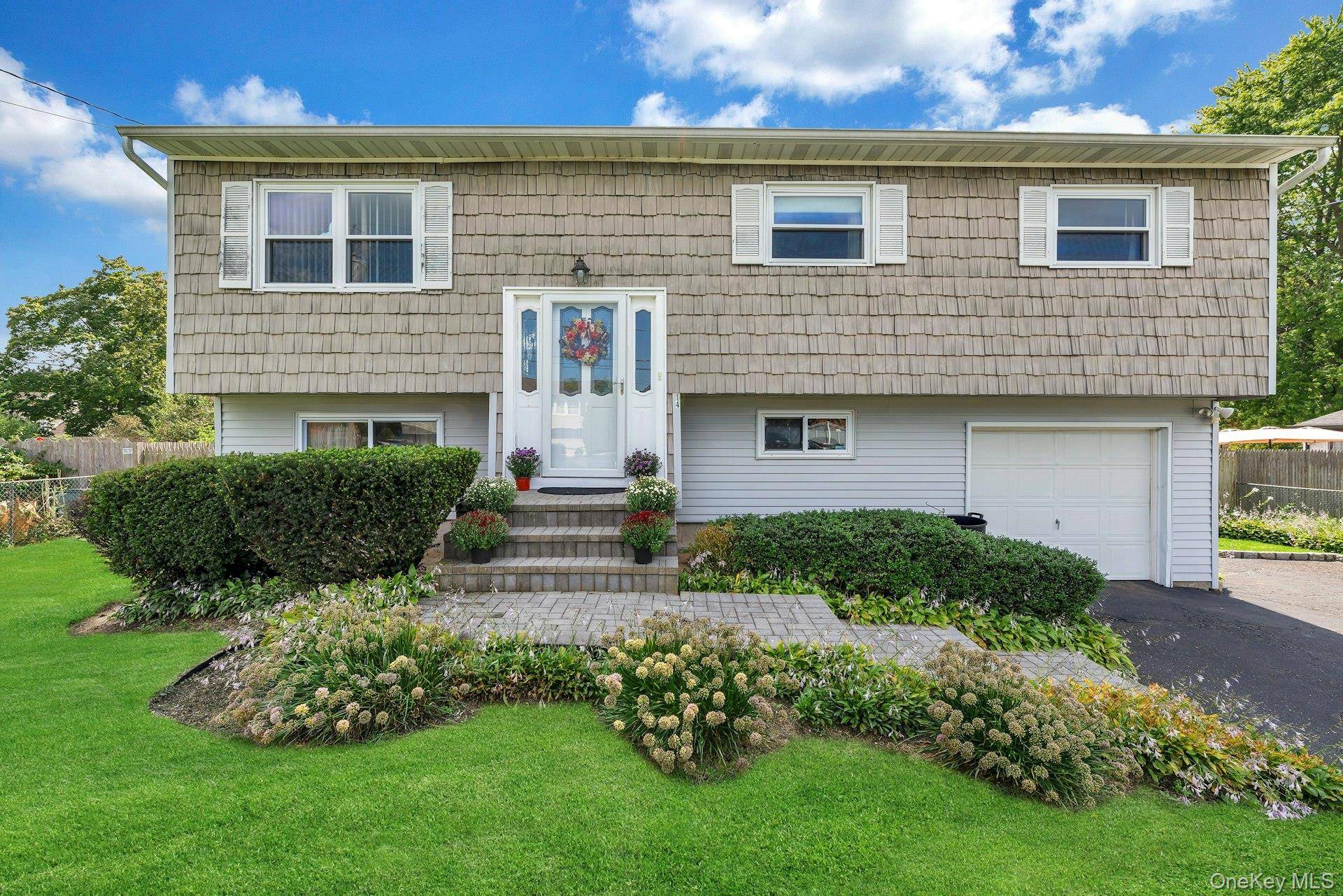 Step into this beautifully maintained Hi Ranch nestled in the sought after Holiday Park neighborhood of Centereach.