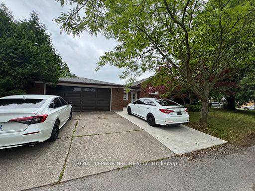 Welcome to this beautifully renovated 5 bedroom home, perfectly situated on a spacious lot with no backyard neighbors and backing directly onto a quiet schoolyard.