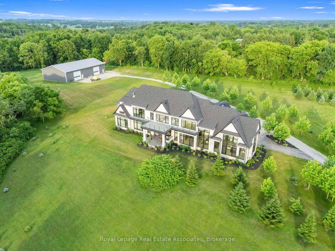 Welcome to an architectural masterpiece nestled on 18 private acres of picturesque landscape.
