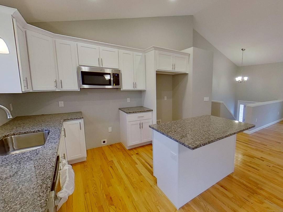 Construction has begun on this New Contemporary Raised Ranch on a Beautiful Wooded Lot.