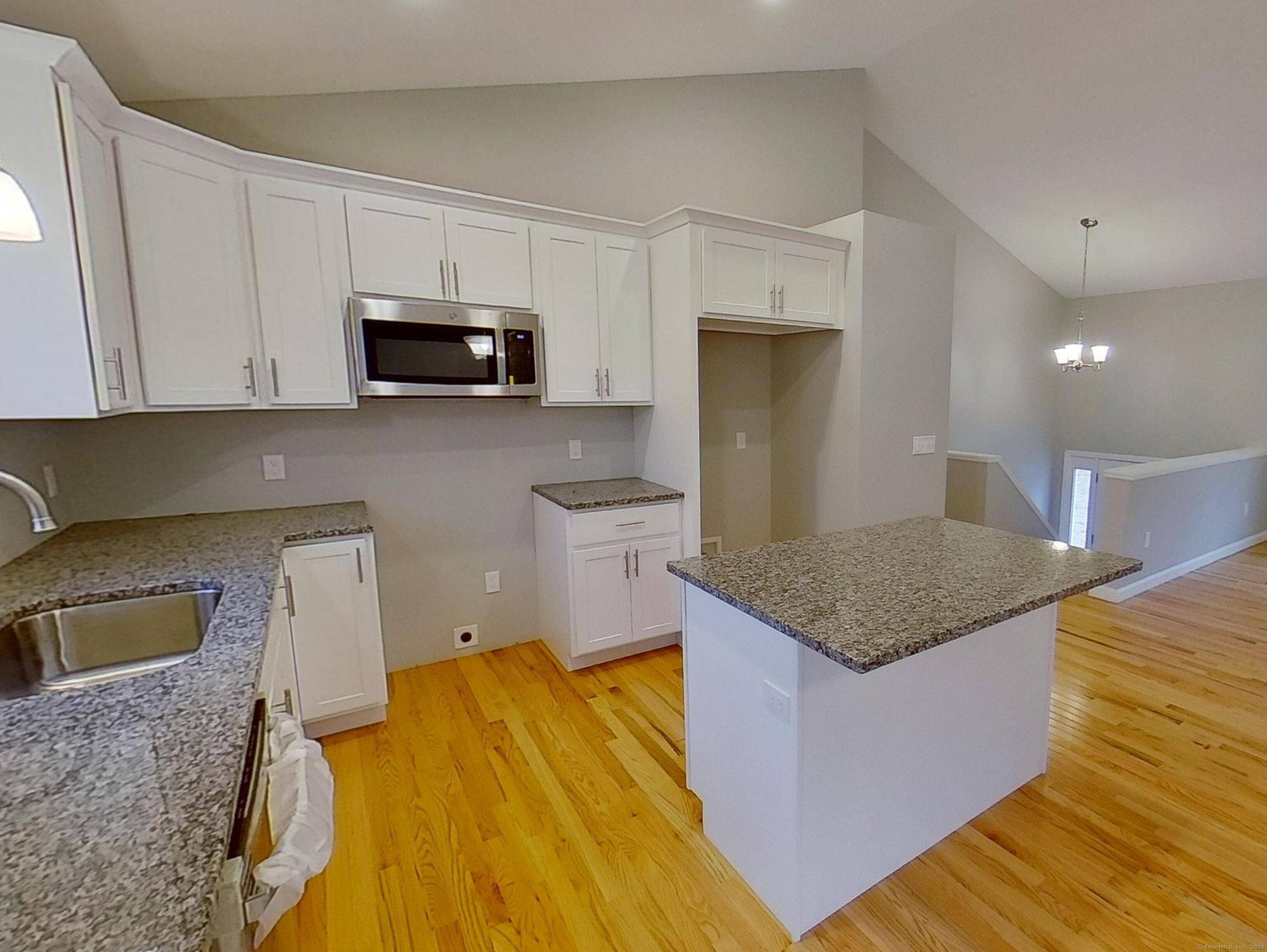 Construction has begun on this New Contemporary Raised Ranch on a Beautiful Wooded Lot.