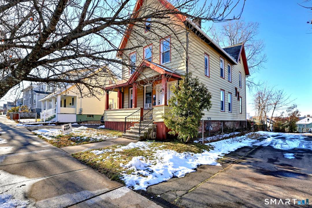 Investor's Dream in Fair Haven Heights Approved 3 Family Conversion with Water Views.