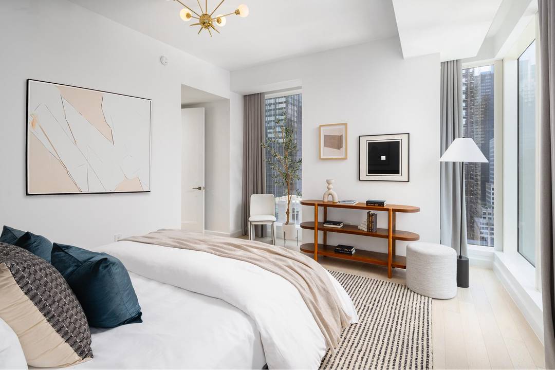 Immediate Occupancy. This expansive one bedroom, one and a half bathroom residence designed by Champalimaud offers northern, western, and southern exposures through floor to ceiling windows.