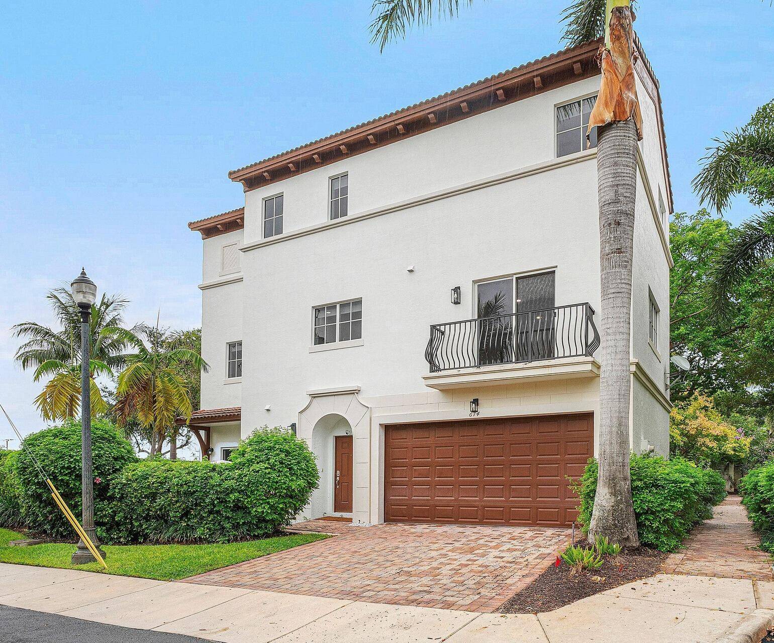 Reimagined Library Commons Villa detached residence sited in one of downtown Boca Raton's sought after enclaves.