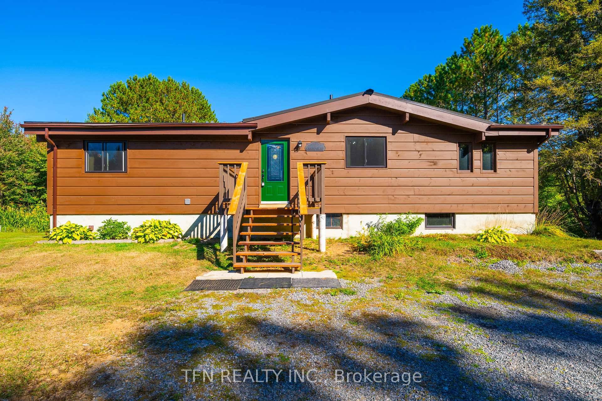Discover a tranquil retreat on 25 acres of picturesque woodlands, complete with a serene stream, nestled in a private setting.