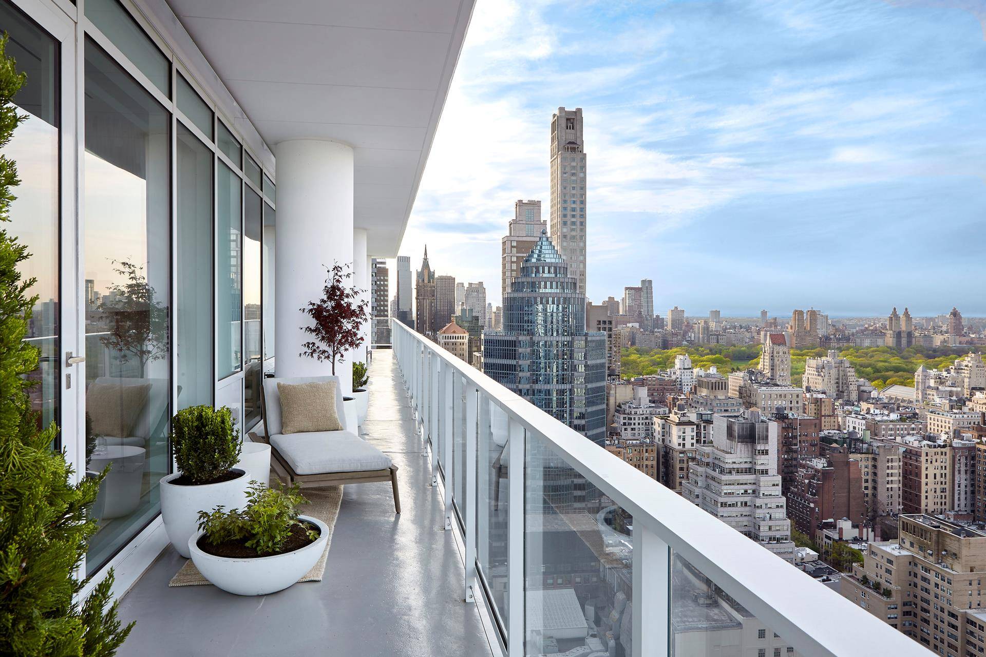 This spacious, half floor 1, 555 square foot, two bedroom, two and a half bath residence features 14' ceilings, floor to ceiling windows, and an expansive north facing terrace with ...