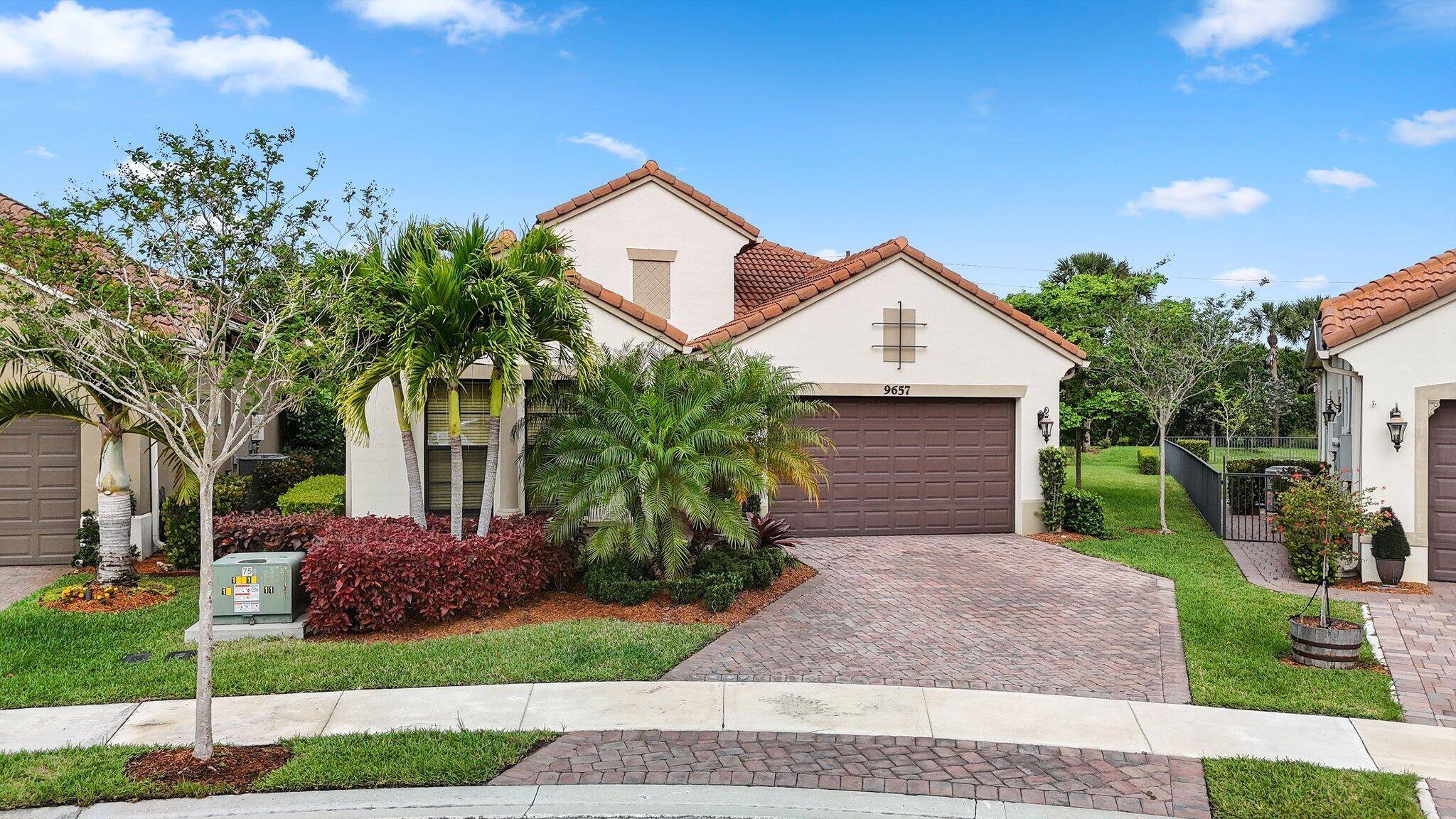 Welcome to 9657 Kalmar Circle West, a spacious and inviting home in Parkland, FL.