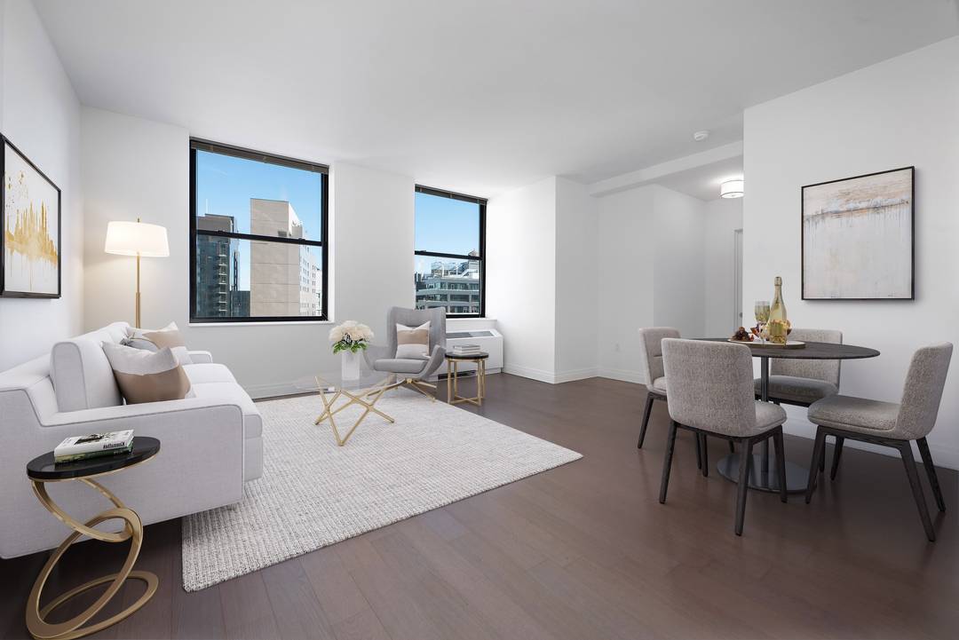 This two bed two bath apartment features spacious primary bedroom with a dedicated dressing area with an en suite primary bath, spacious living dining area, second bedroom with double exposure ...