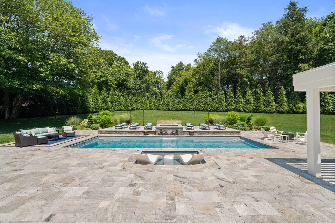 As featured in JamesEdition Every moment feels like a retreat for guests of all ages at this completely remodeled and expanded Colonial at 15A Shore Rd.