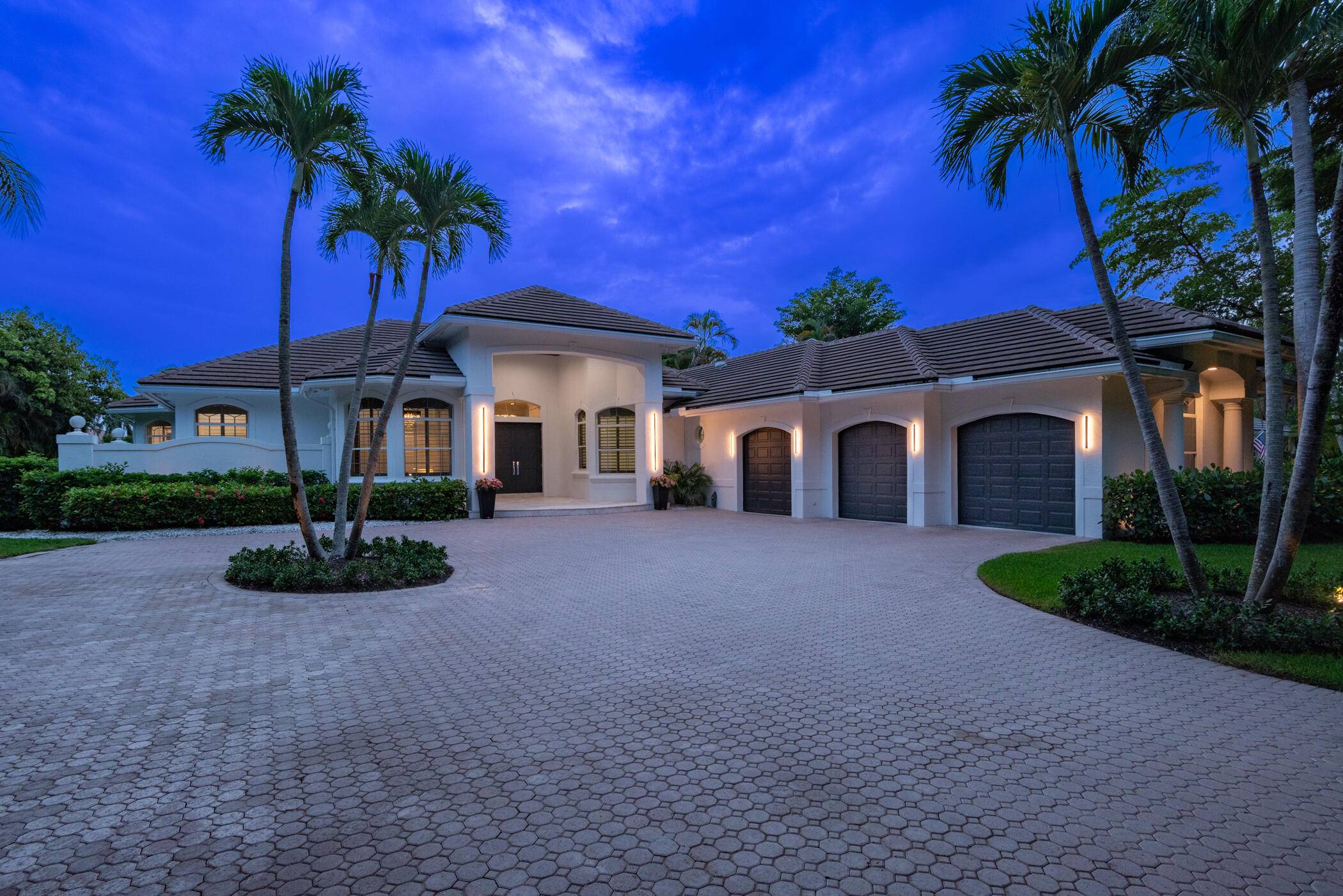 Stunning renovated one story home in Palm Beach Gardens on an acre lot in the gated community of Steeplechase.