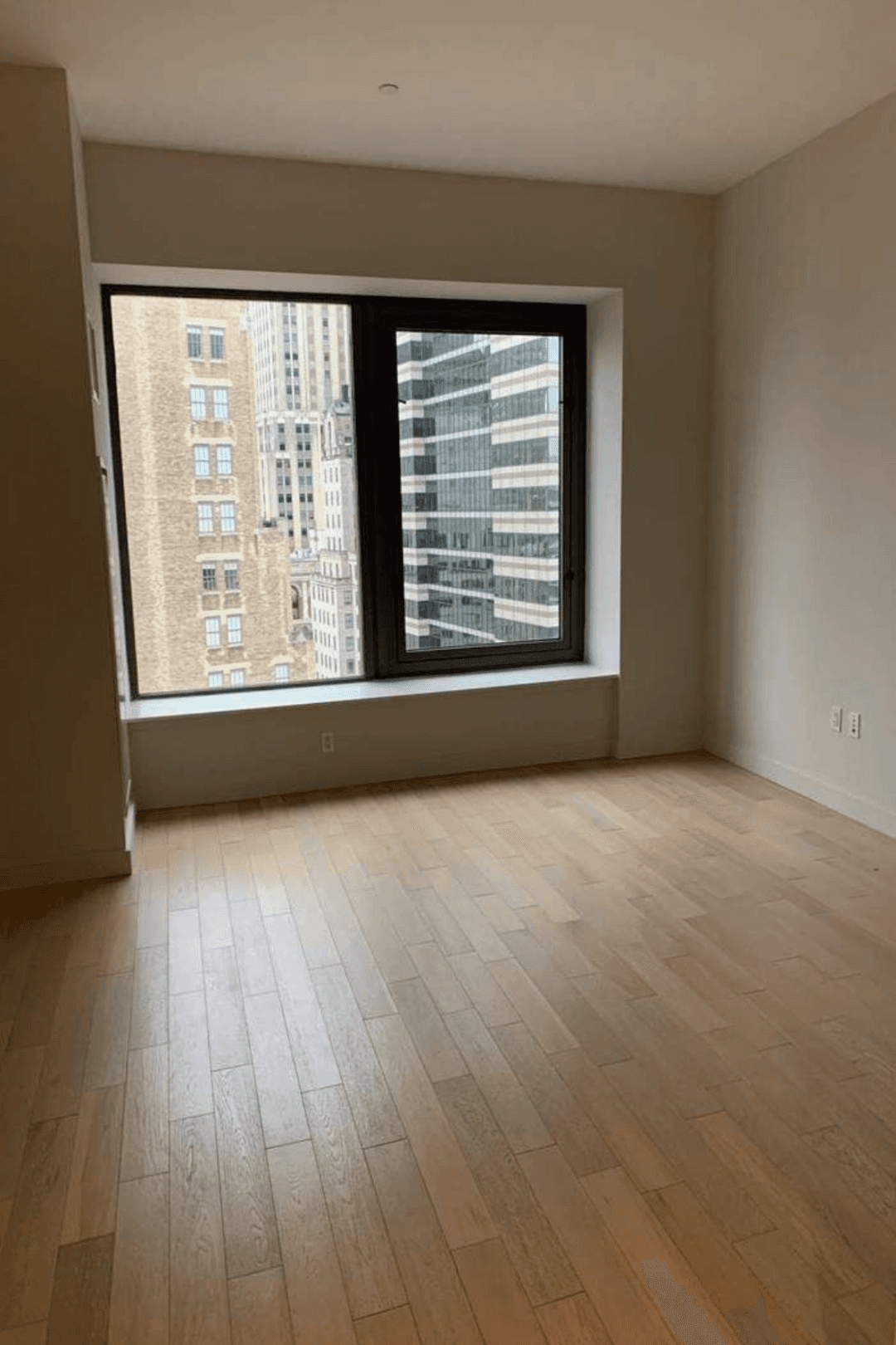 Motivated Seller Step into this bright and airy studio, where natural light pours in through oversized windows, framing stunning views of the Financial District and the East River.