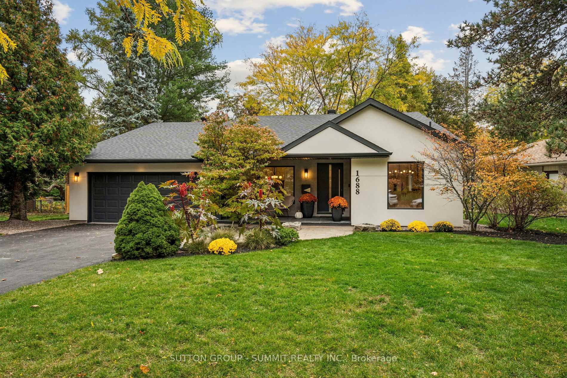 Welcome to your dream home in prestigious Clarkson, nestled south of Lakeshore on a sprawling 95 x 155 ft lot offering exceptional privacy and modern elegance.