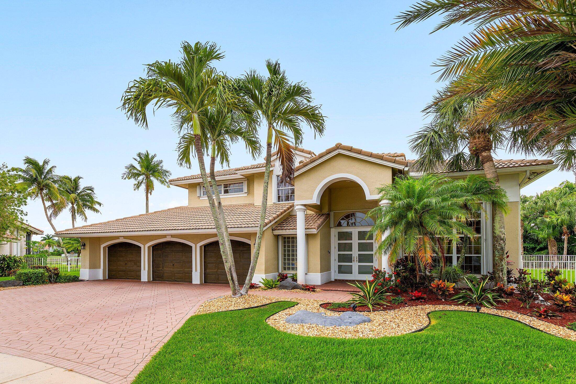 Elegant updated Lakefront home in highly sought after Boca Isles North.