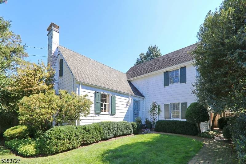 Enchanting custom built Colonial offering 6 rooms, 3 BR's one on 1st floor, 3 baths.