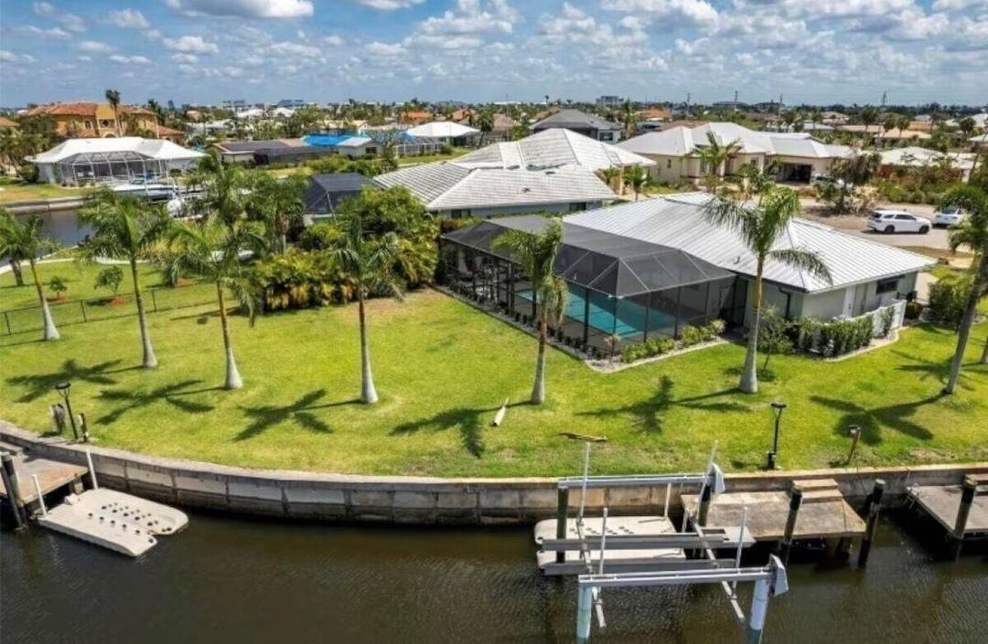 Experience Florida living at its best in this beautiful waterfront home with two private docks, a boat lift, kayak lift, and jet ski platform !