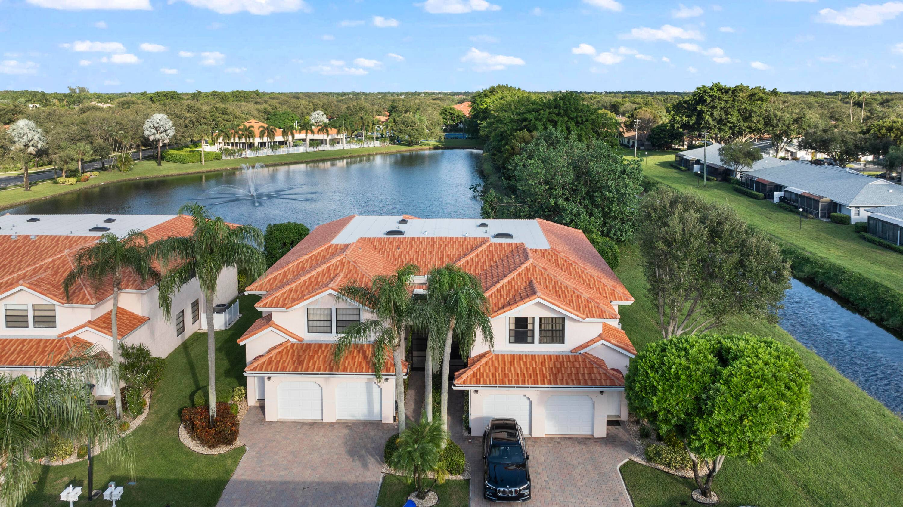 Lake and fountain views from this secluded, end of row, beautiful 3 bedroom split plan Townhouse Condo in the desirable Villa San Remo.