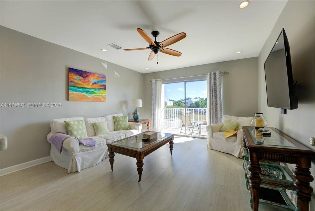 This beautifully updated waterfront condominium captures the essence of the Florida Keys lifestyle along a serene 200 ft wide deep water canal with 6 ft control depth and no bridge ...