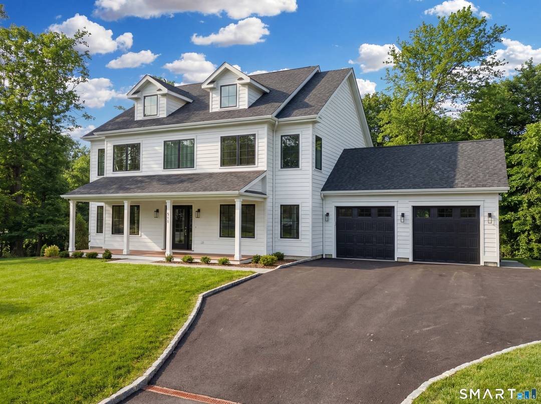 Brand new construction at 511 Den Road offers refined modern living in a peaceful North Stamford setting on 1.
