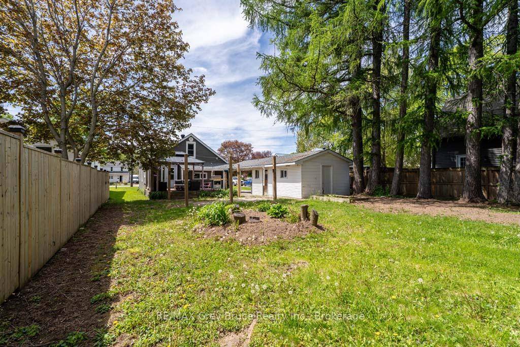 This charming one and a half story home boasts a perfect blend of comfort and functionality.